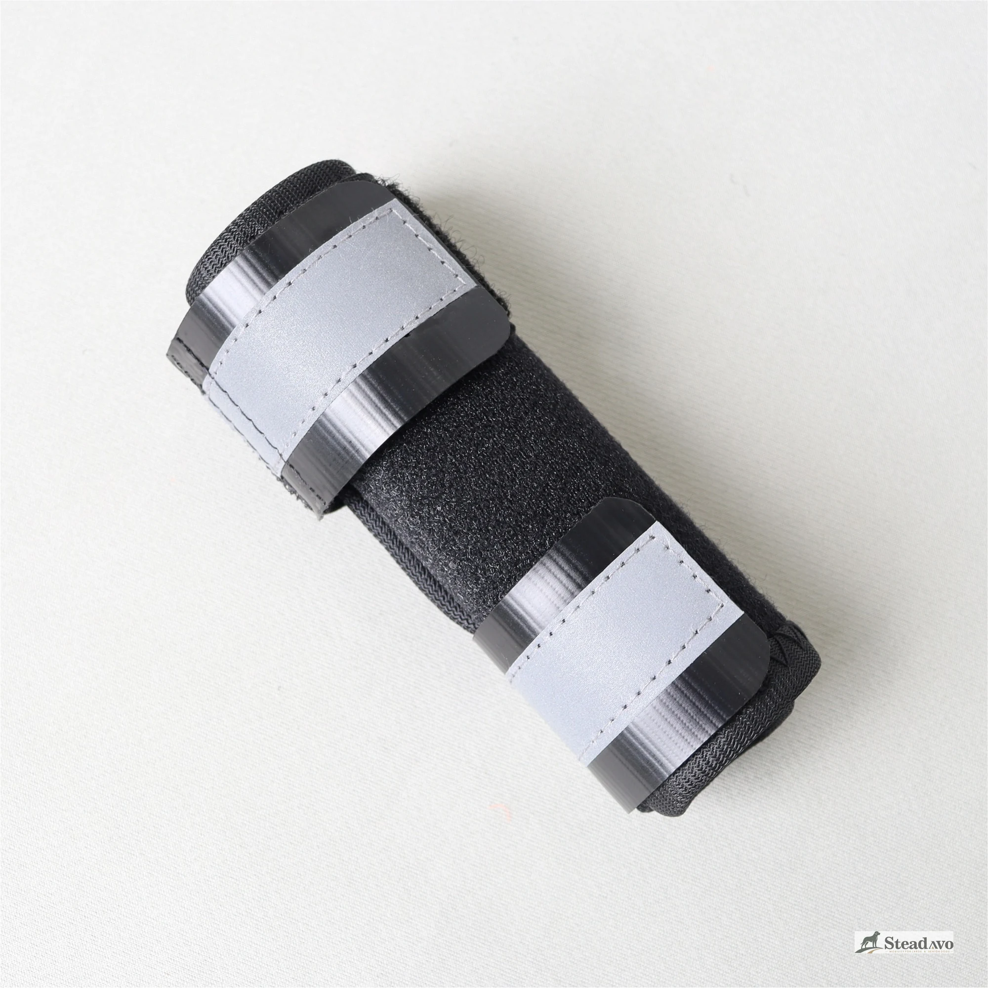 Reflective dog leg support wrap shown flat for pre-use inspection